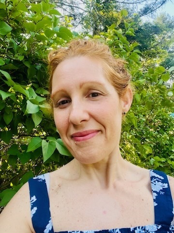 Headshot of Sarah Walker standing outside in nature.